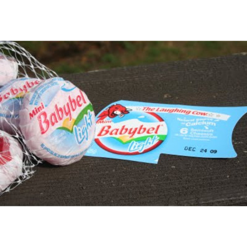 Zoom to enlarge the Mini Babybel Laughing Cow Light Cheese Wedge In Net