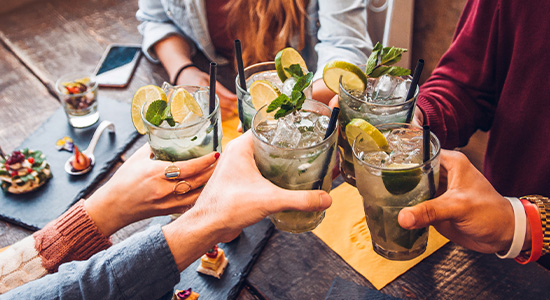 People Toasting With Mojitos